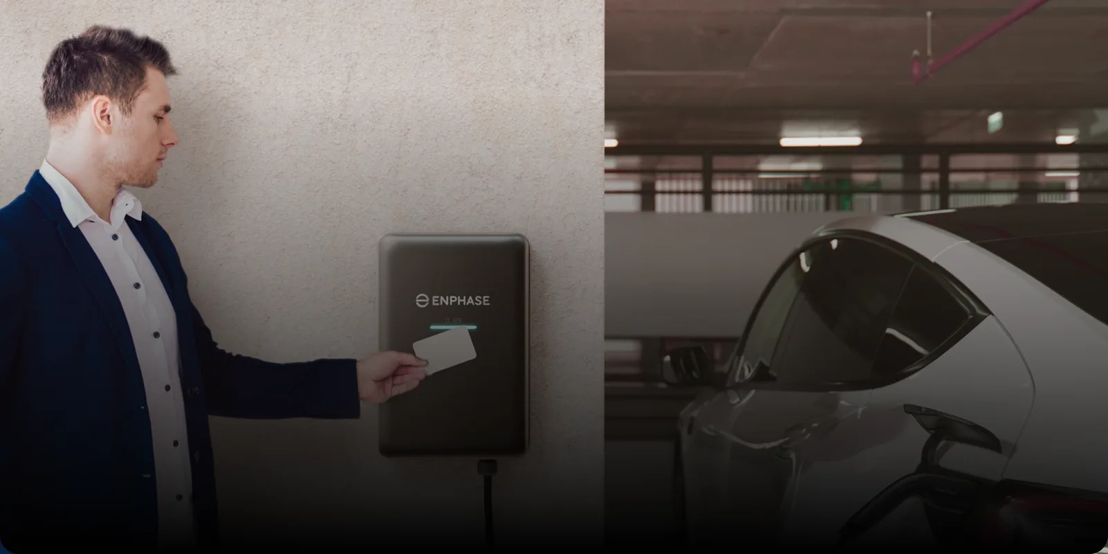 Person tapping an RFID card on a wall-mounted Enphase IQ EV Charger 2 in a parking garage with an EV charging behind