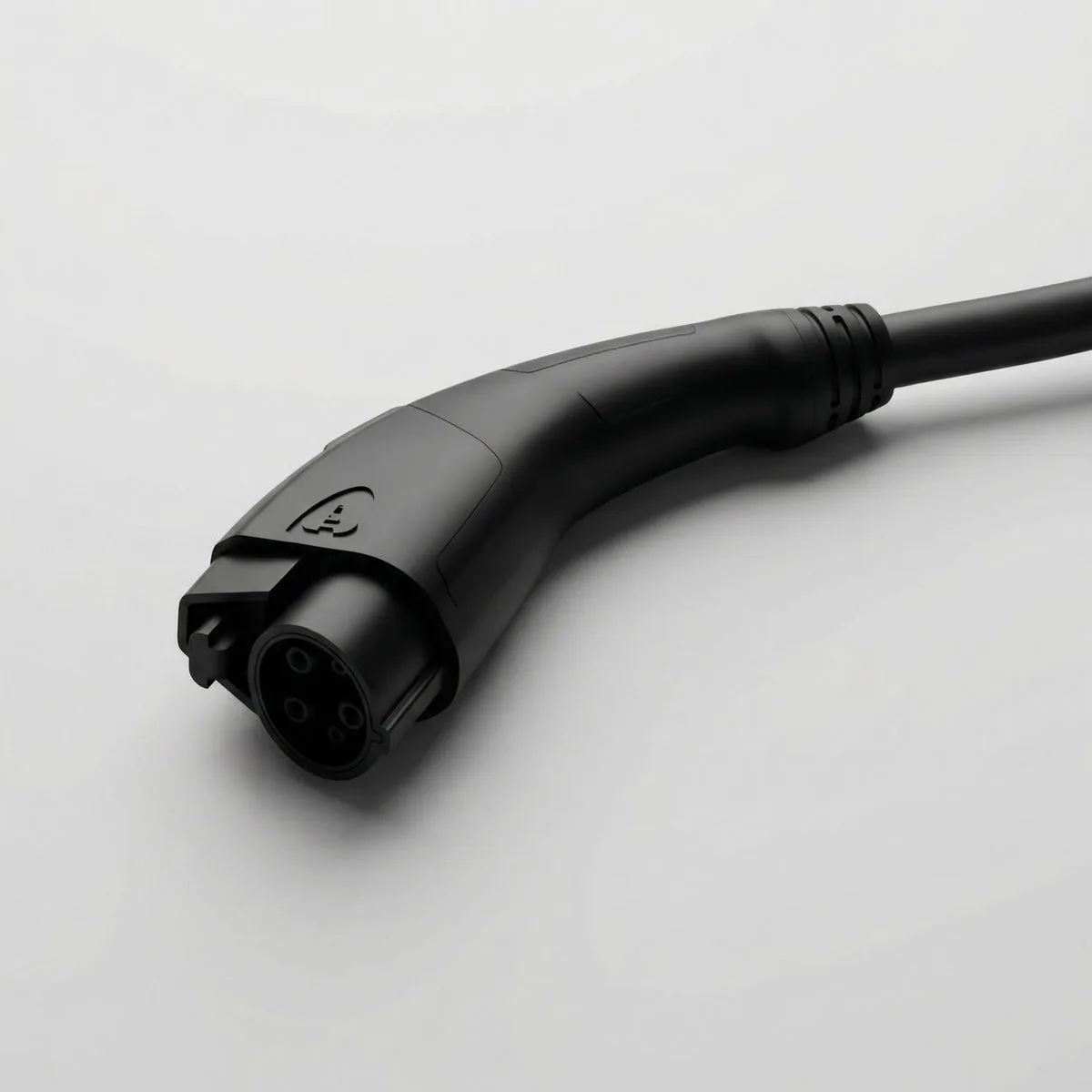 Close-up of the Pulsar Plus J1772 charging connector on a light studio background